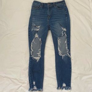 Stoned washed jeans and store bought holes.